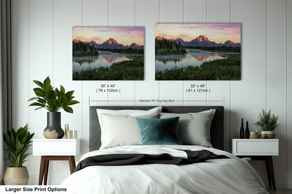 a bedroom with a bed and two pictures on the wall