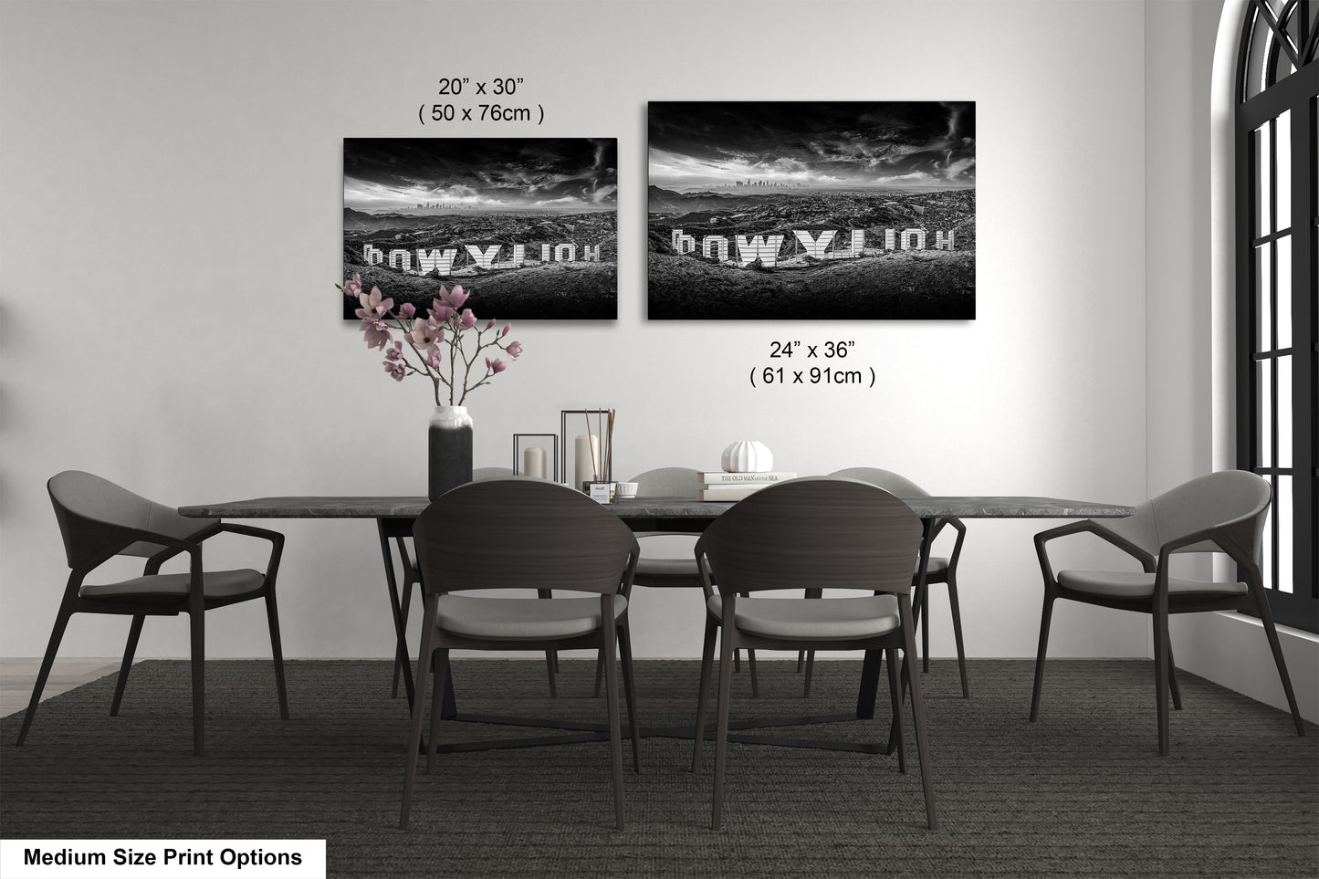 a black and white photo of a table and chairs