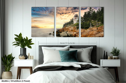 a bedroom with a bed and two paintings on the wall