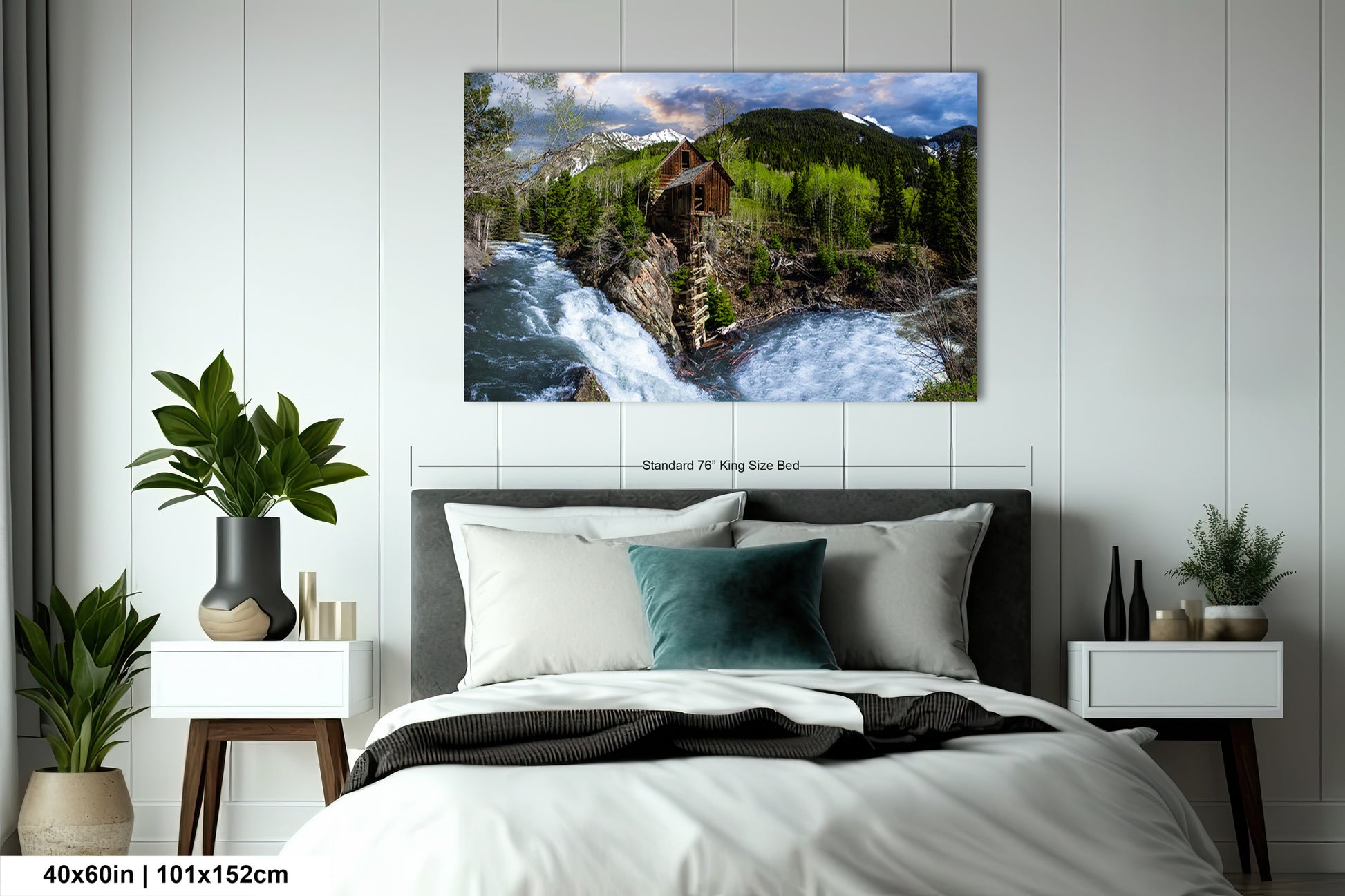 a bed room with a neatly made bed and a painting on the wall