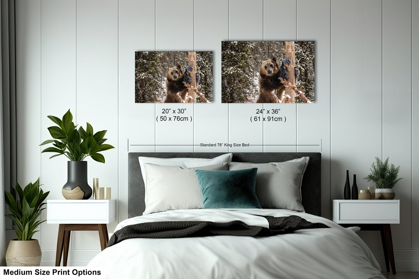 a bed with two pictures on the wall above it