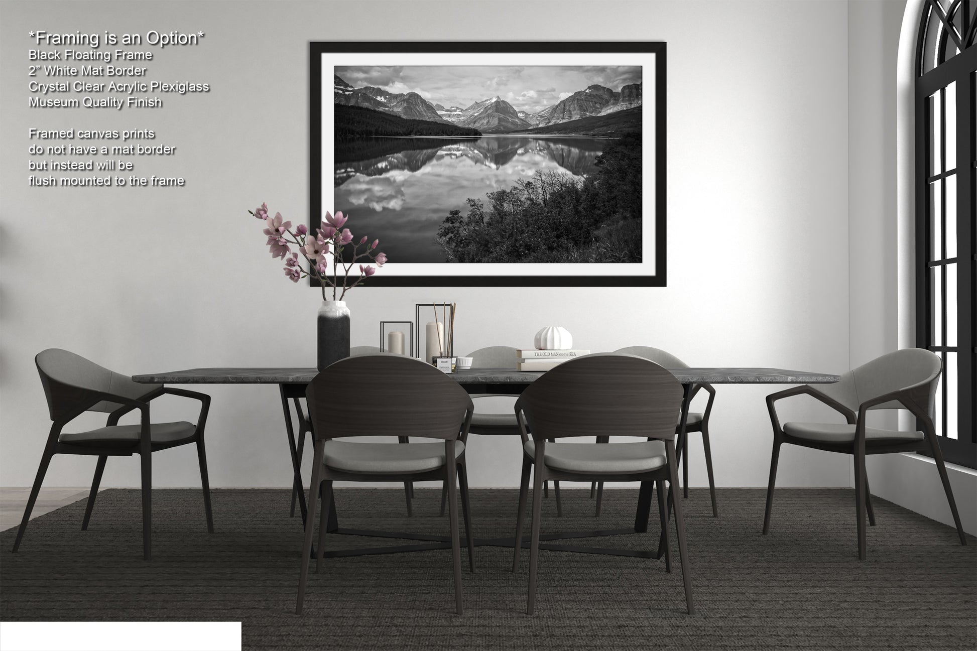 a black and white photo of a table and chairs