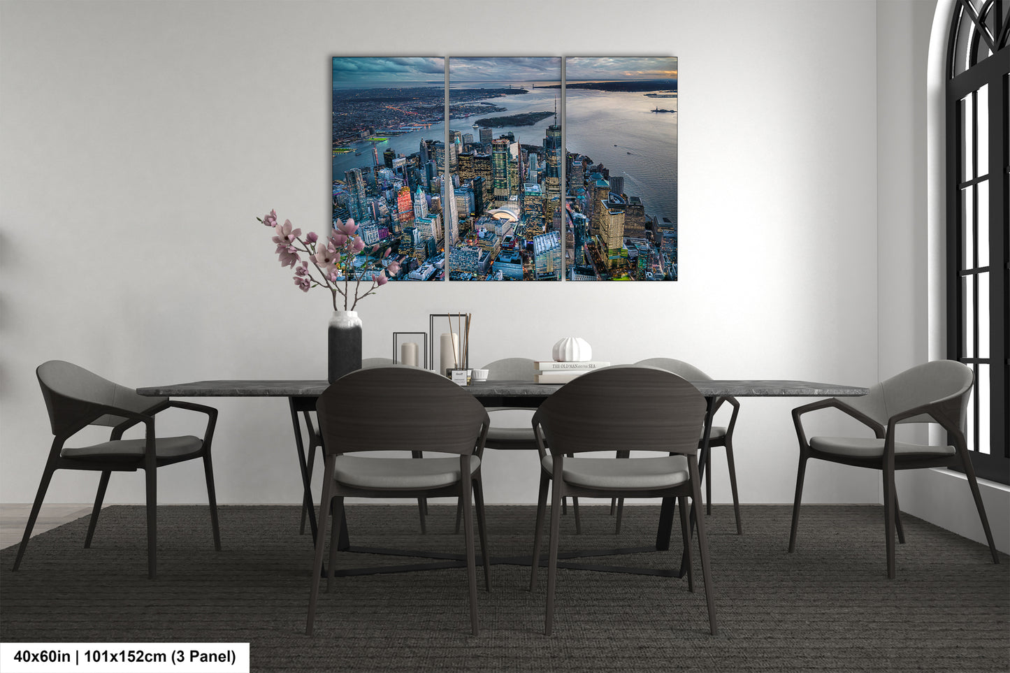 a dining room table with chairs and a painting on the wall