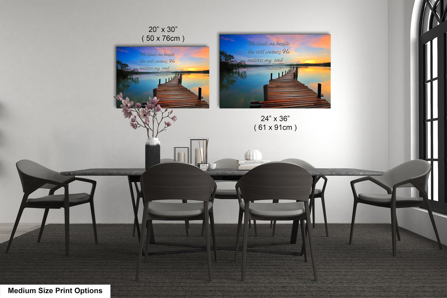 a dining table with four chairs and a vase of flowers