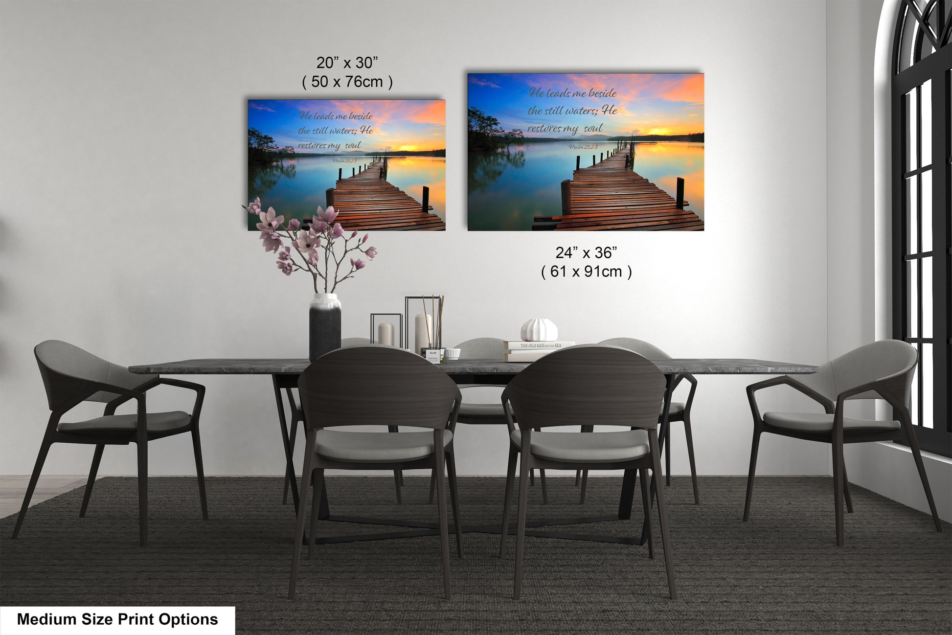 a dining table with four chairs and a vase of flowers