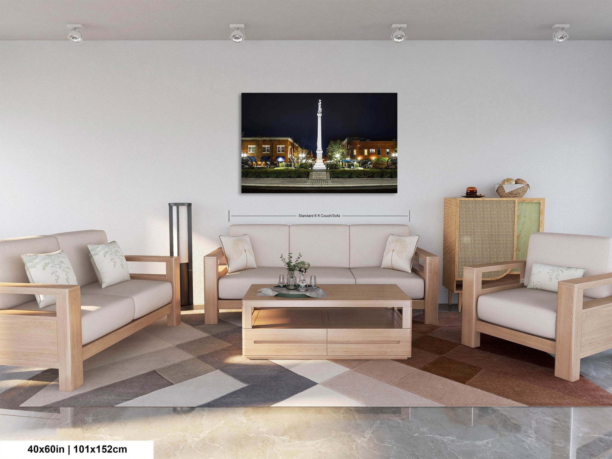 a living room filled with furniture and a painting on the wall