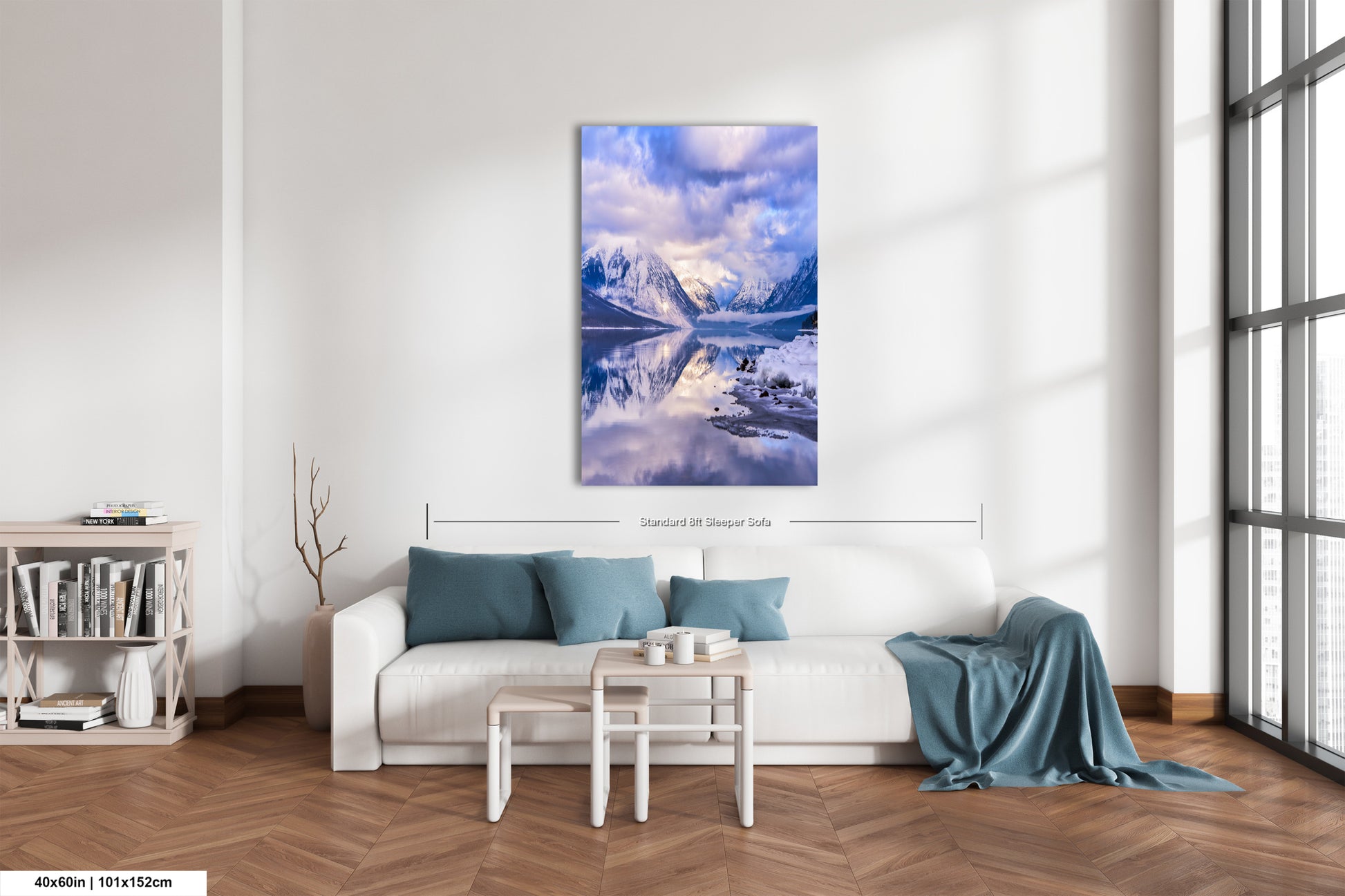 a living room with a white couch and a painting on the wall