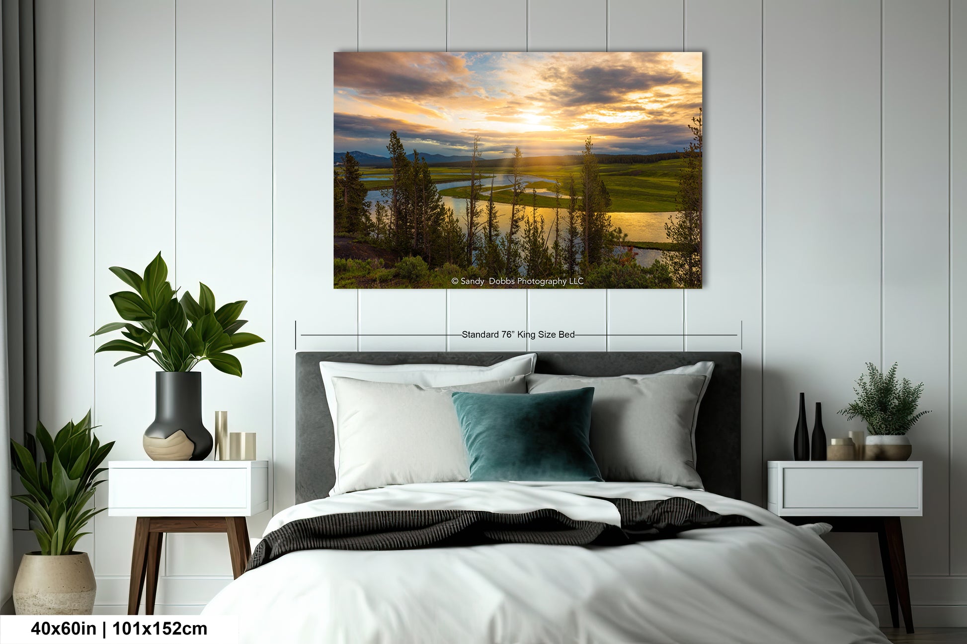 a bedroom with a bed and a painting on the wall