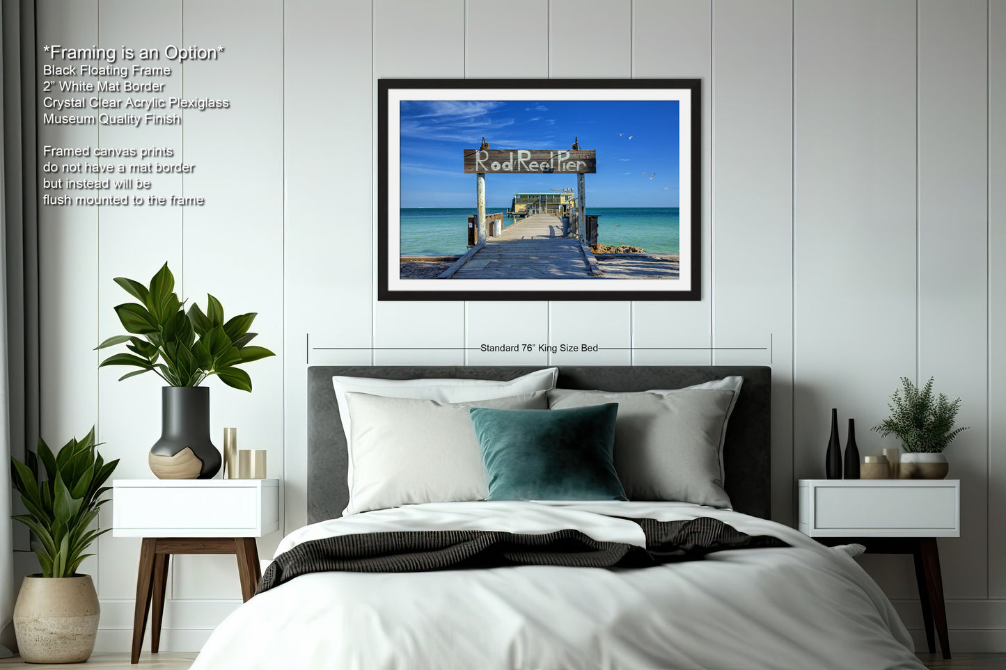 a bedroom with a bed and a picture hanging on the wall