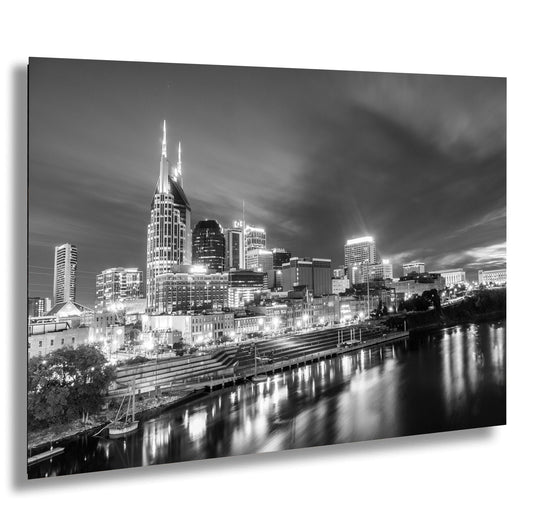 a black and white photo of a city at night
