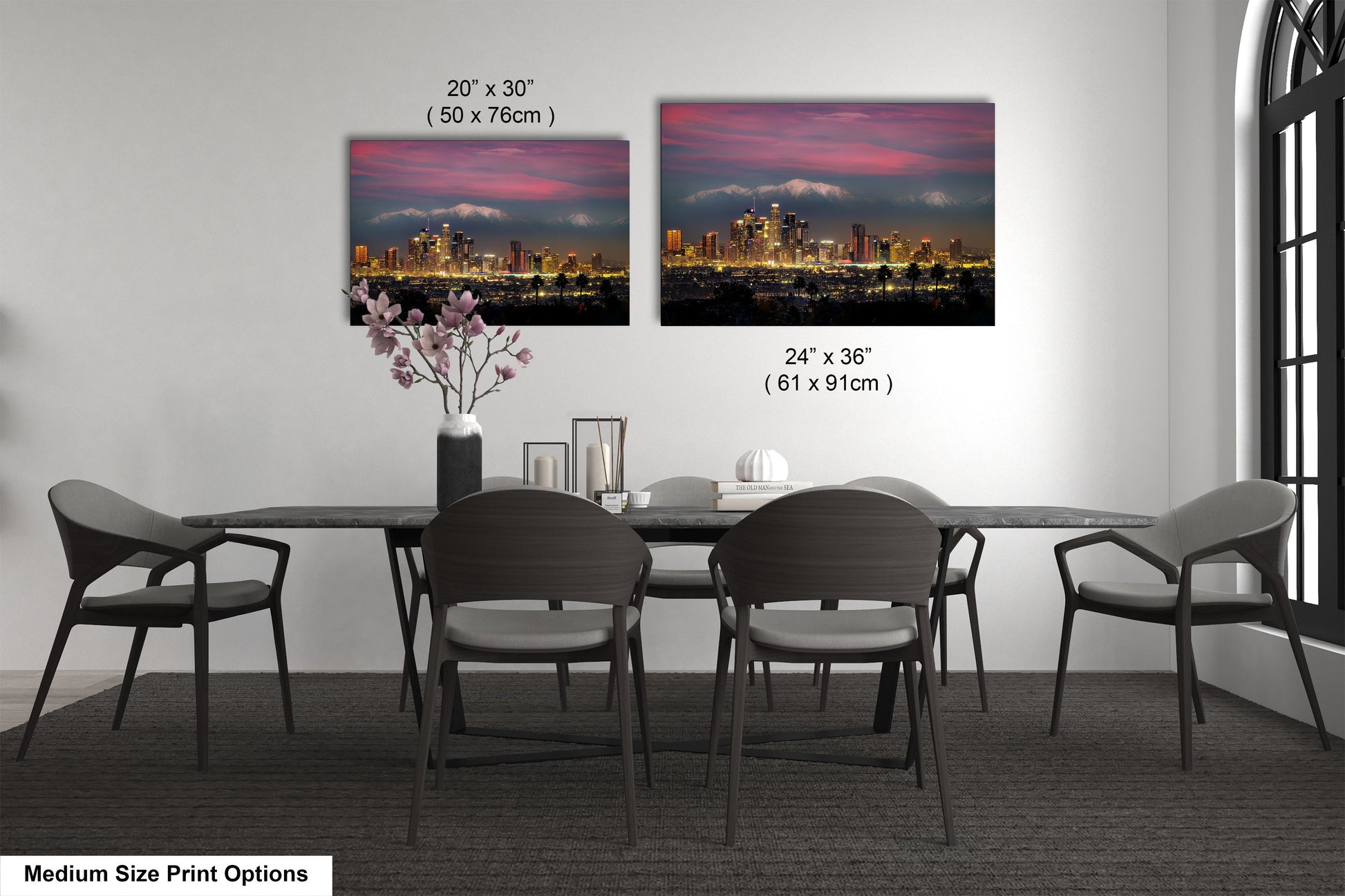 a dining room table with chairs and a vase of flowers