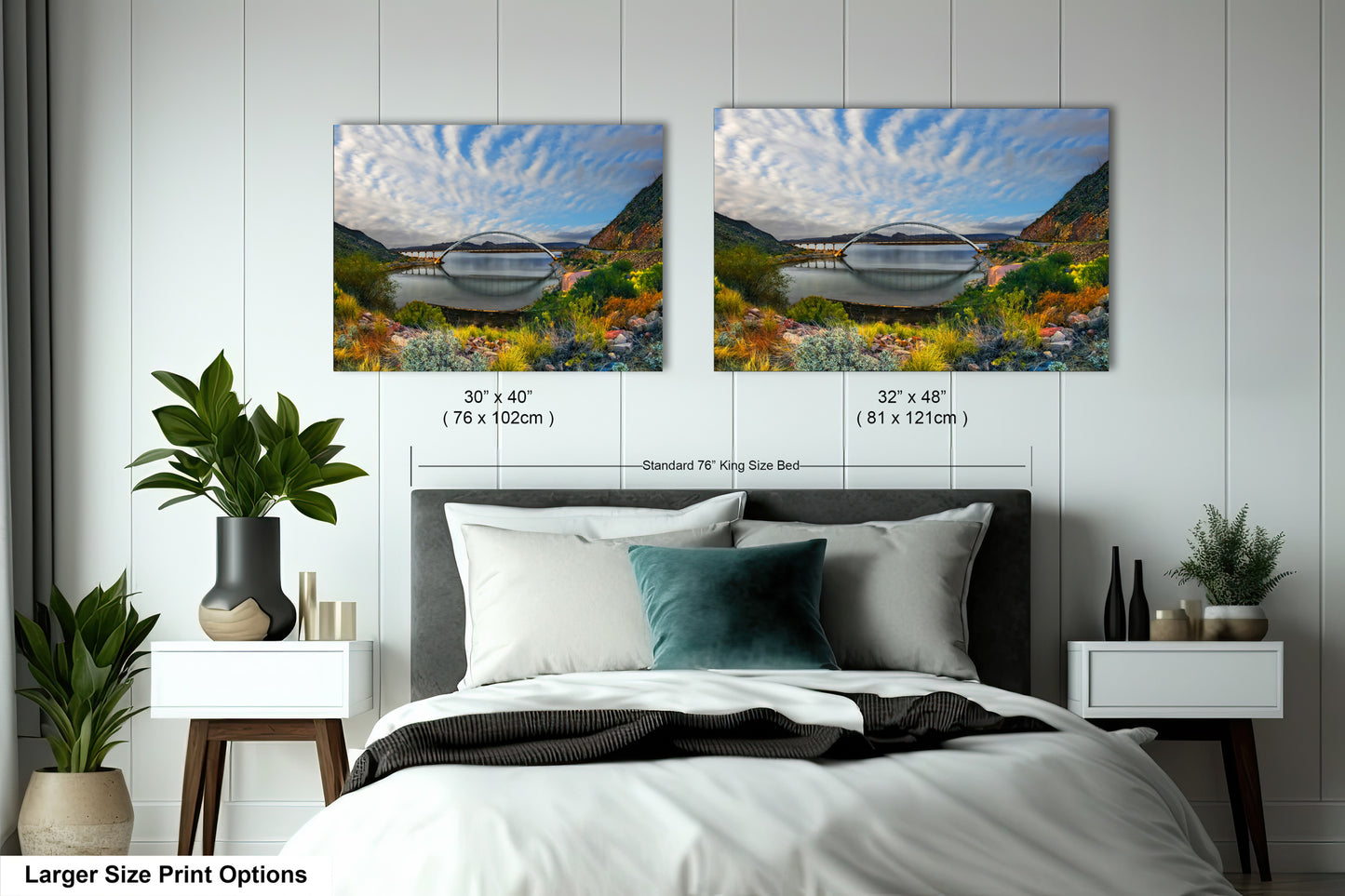 a bedroom with a bed and two pictures on the wall