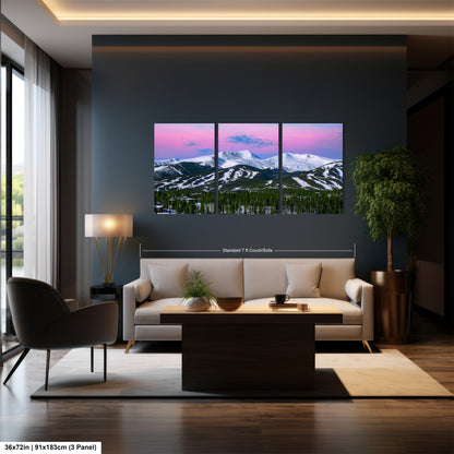 a living room filled with furniture and a painting on the wall