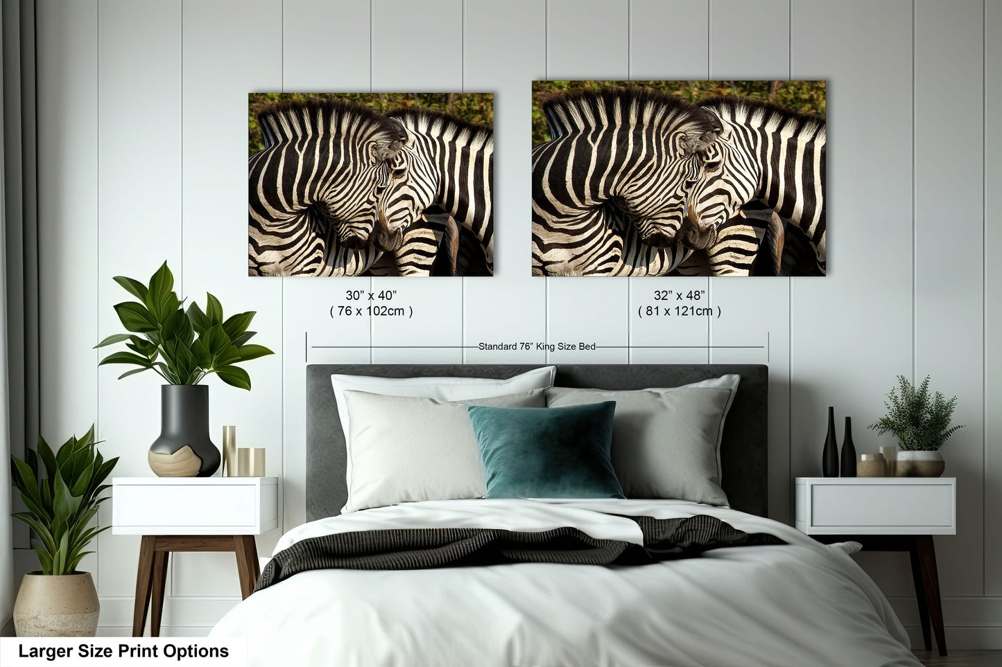 a couple of zebra standing next to each other on a bed