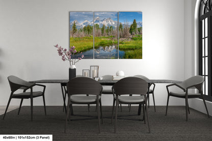 a dining room table with chairs and a painting on the wall