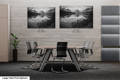 a black and white photo of a table and chairs