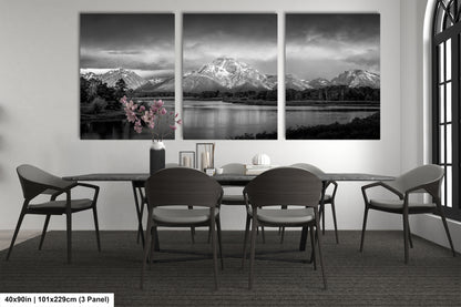 a black and white photo of a dining room table