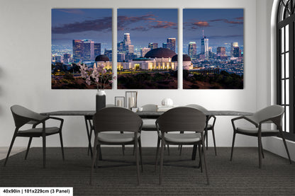 a dining room table with four chairs and a view of a city