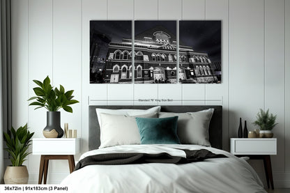 a hotel room with a bed and a plant