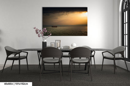 a dining room table with chairs and a vase of flowers