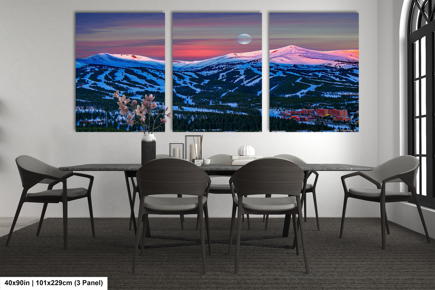 a dining room with a table and four chairs