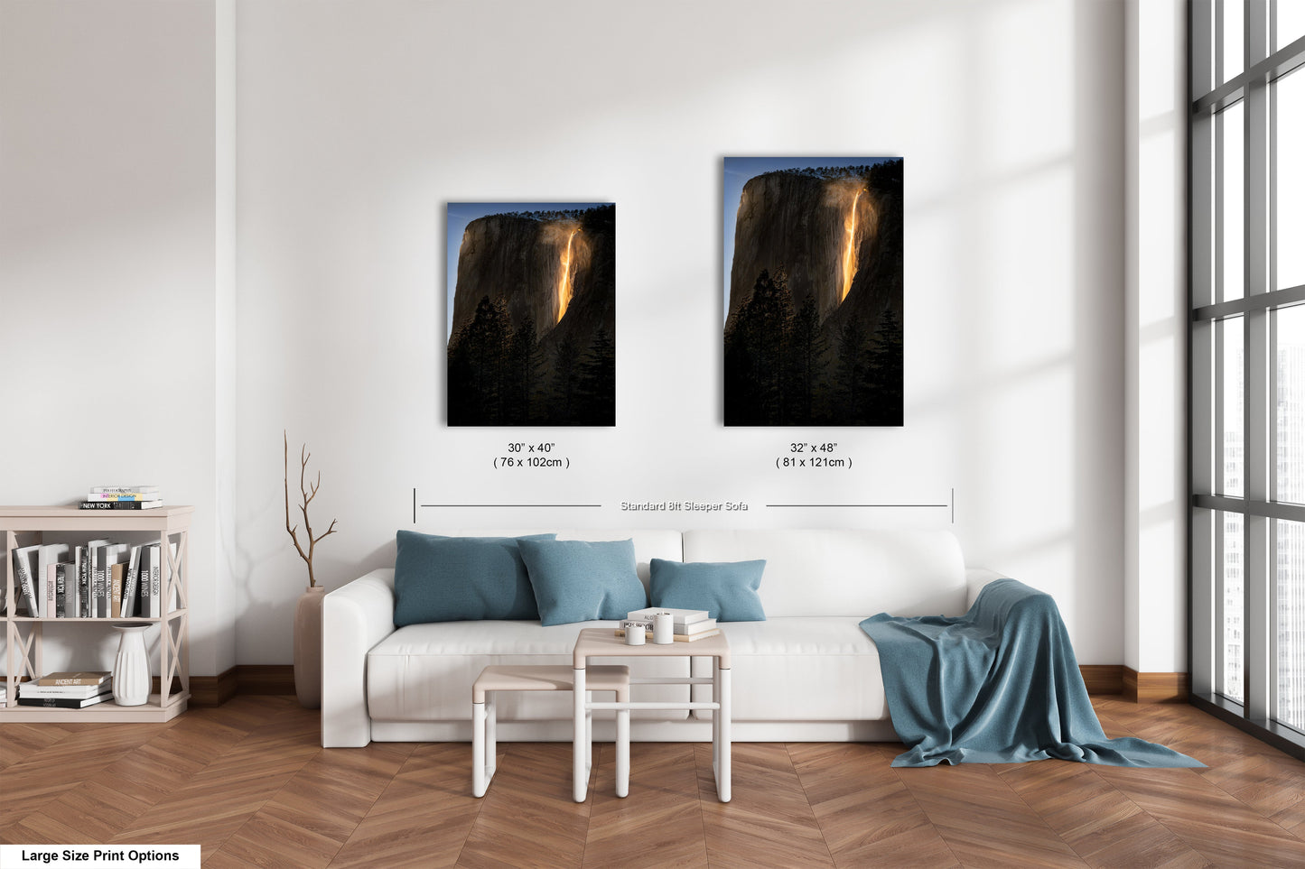 a living room with a white couch and two pictures on the wall