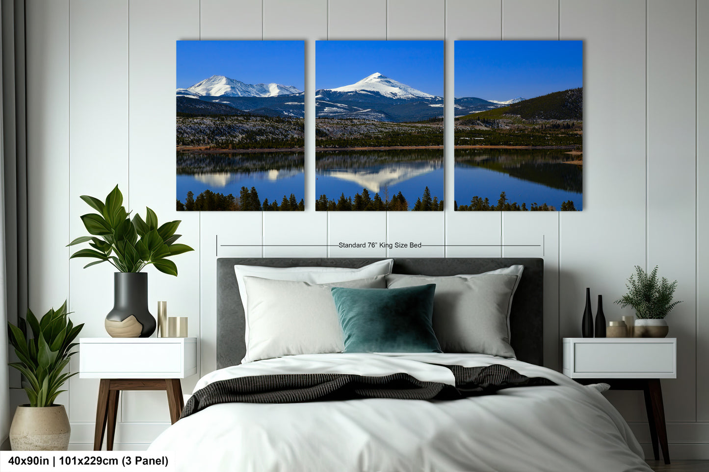 a bedroom scene with a bed and two paintings on the wall