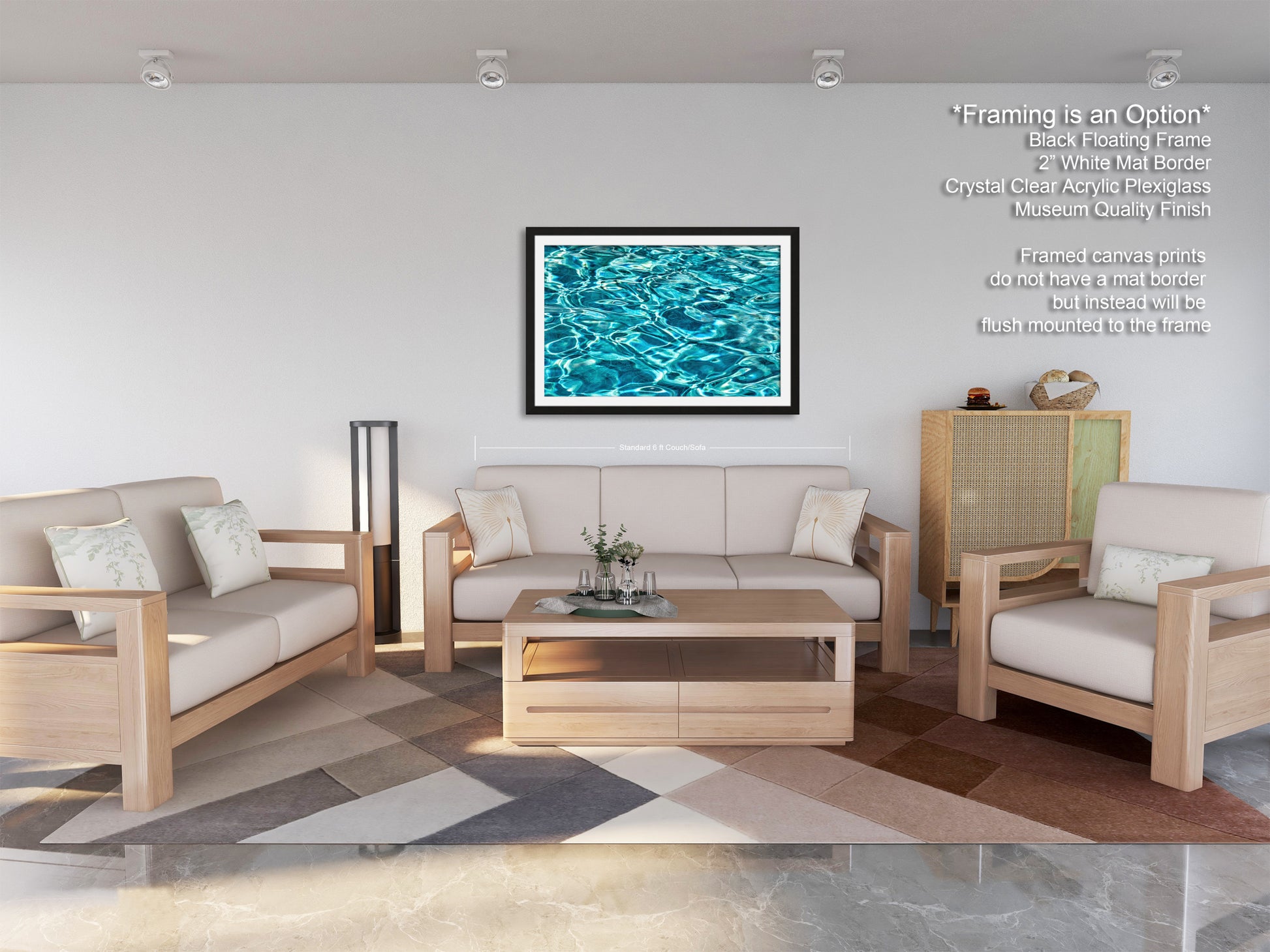 a modern living room with a white sofa, two matching armchairs, and a wooden coffee table. The room has a geometric patterned rug on the floor, and a framed artwork of a blue and green water surface hangs on the wall.