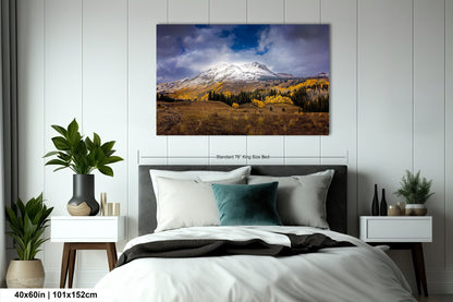 a bedroom with a bed and a painting on the wall