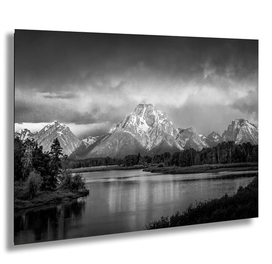 a black and white photo of a mountain range