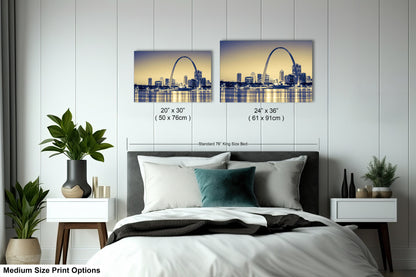 a bedroom with a bed and two pictures on the wall