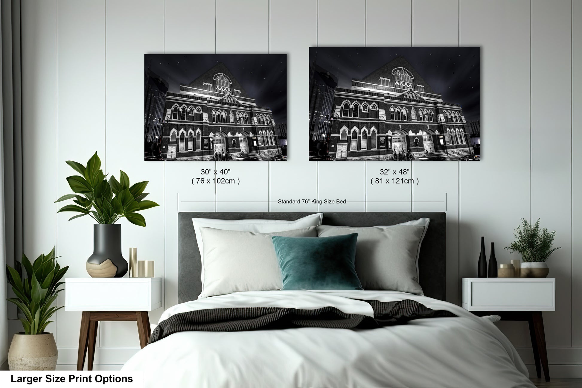a bed with two pictures on the wall above it