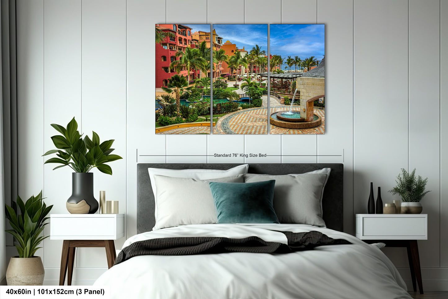 a bed room with a neatly made bed and a painting on the wall