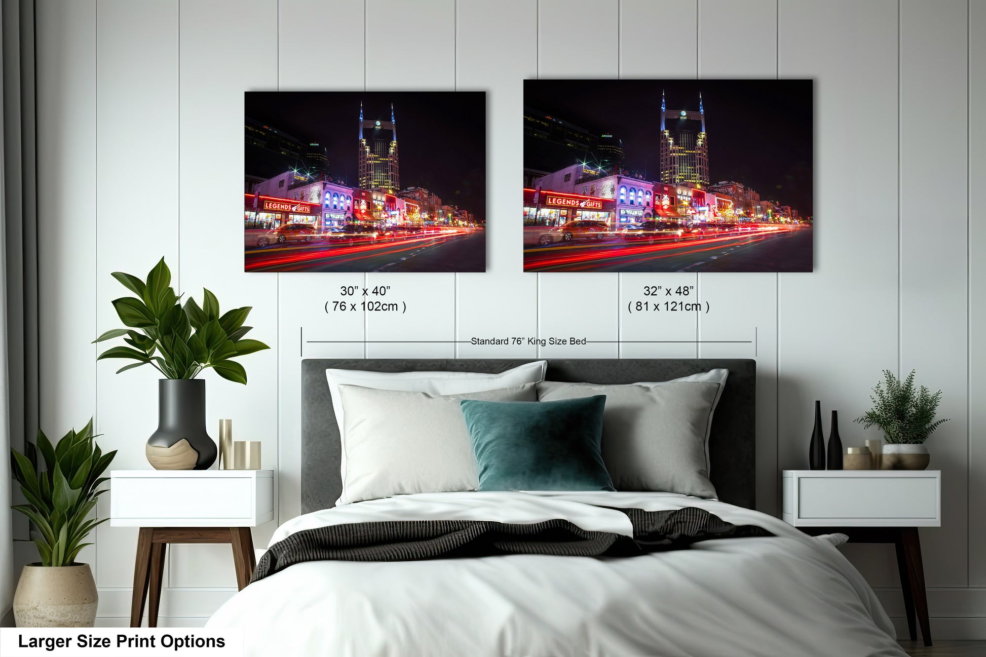 a bed with two pictures on the wall above it