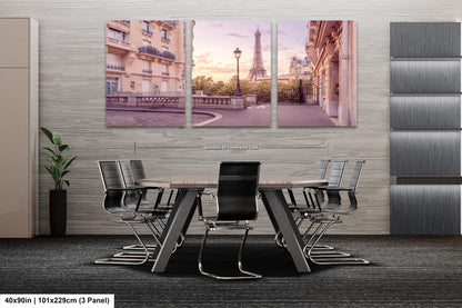 a dining room table with chairs and a picture of the eiffel tower in