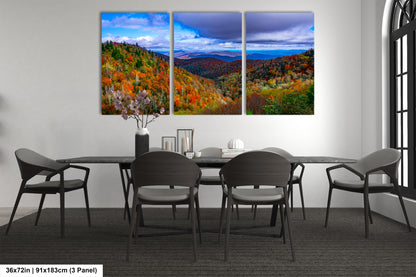a dining room table with chairs and a painting on the wall