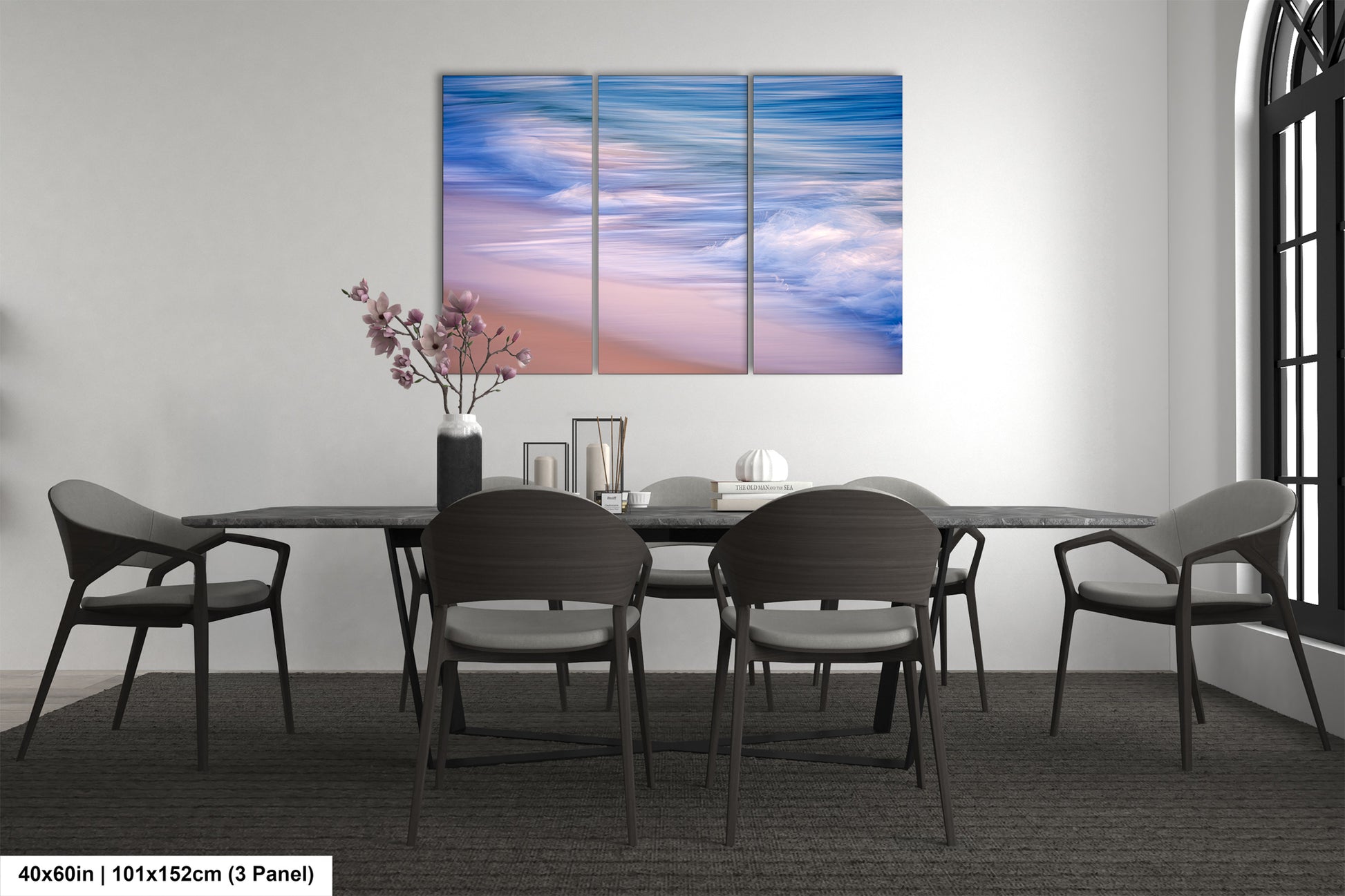 a dining room table with chairs and a painting on the wall