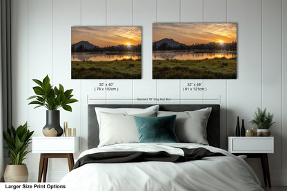 a bedroom with a bed and two pictures on the wall