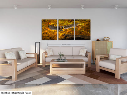 a living room filled with furniture and a painting on the wall