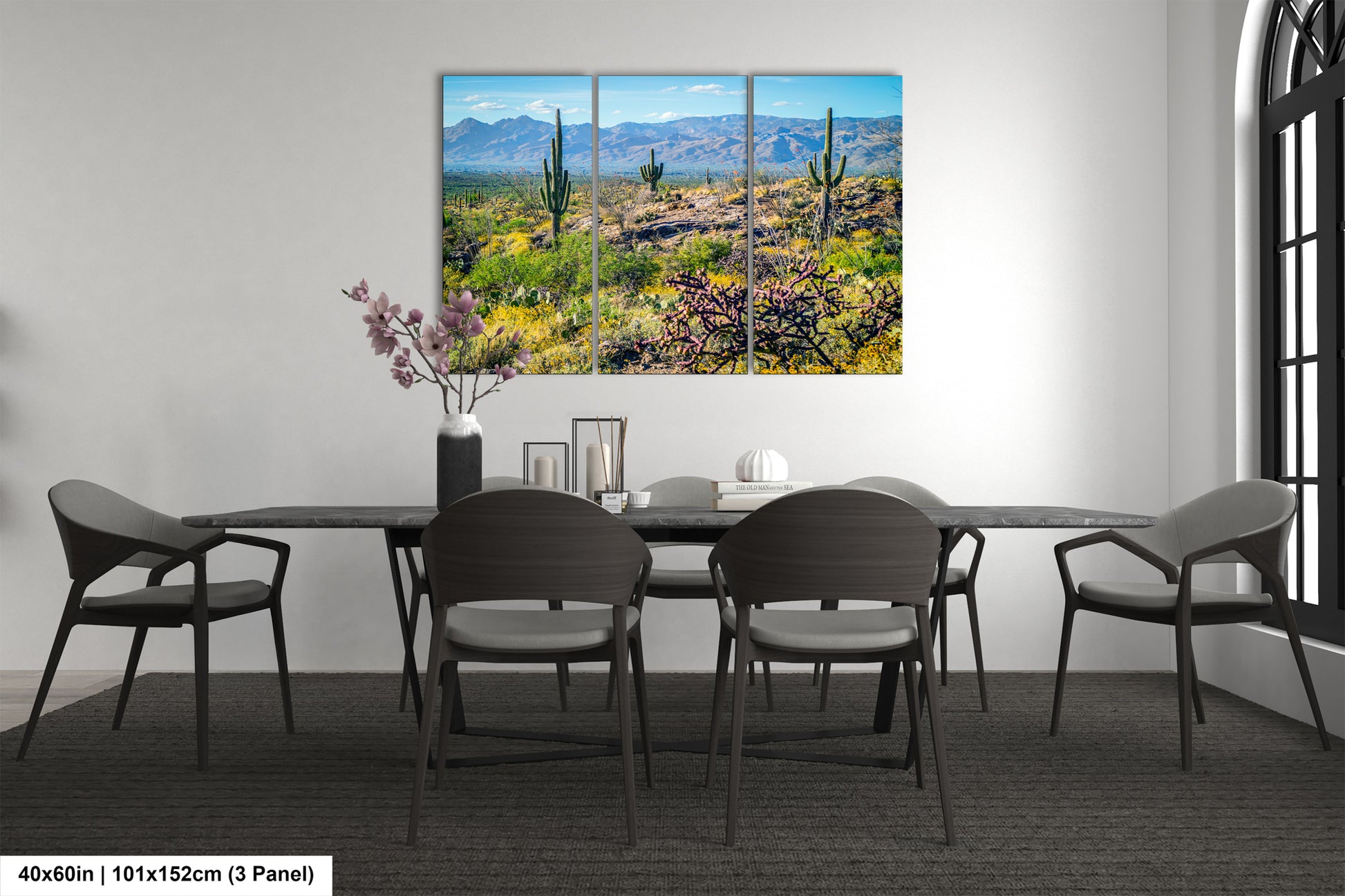 a desert landscape with mountains in the background, featuring cacti and other desert vegetation.