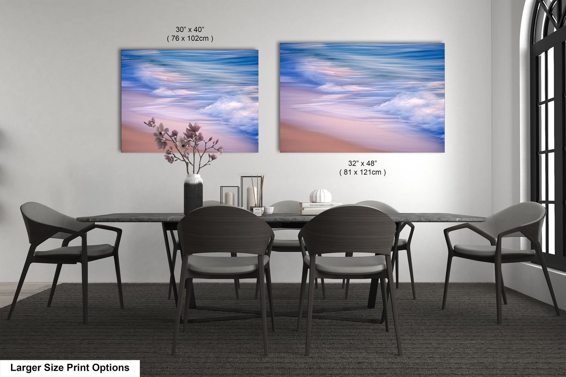 a dining room table with four chairs and a vase with flowers