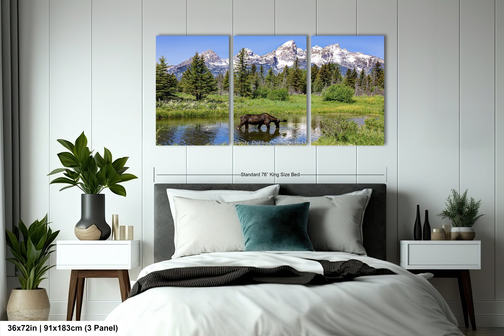 a bed room with a neatly made bed and a painting on the wall