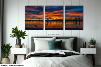 The image is a triptych of a serene sunset over a body of water, featuring a peaceful landscape with silhouetted trees and birds.