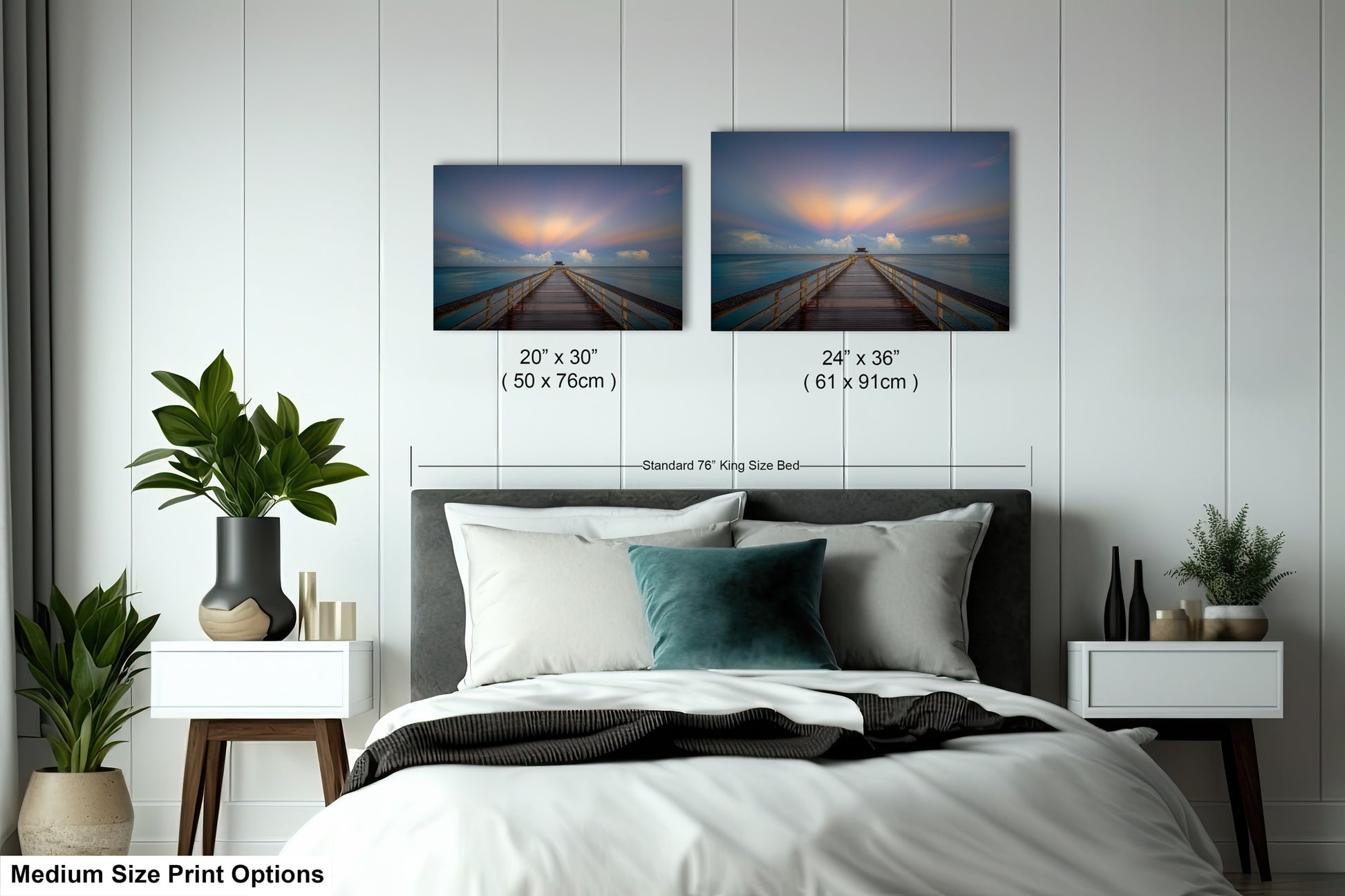 a bedroom with a bed and two pictures on the wall