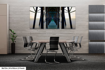 a room with a table and chairs and a painting on the wall