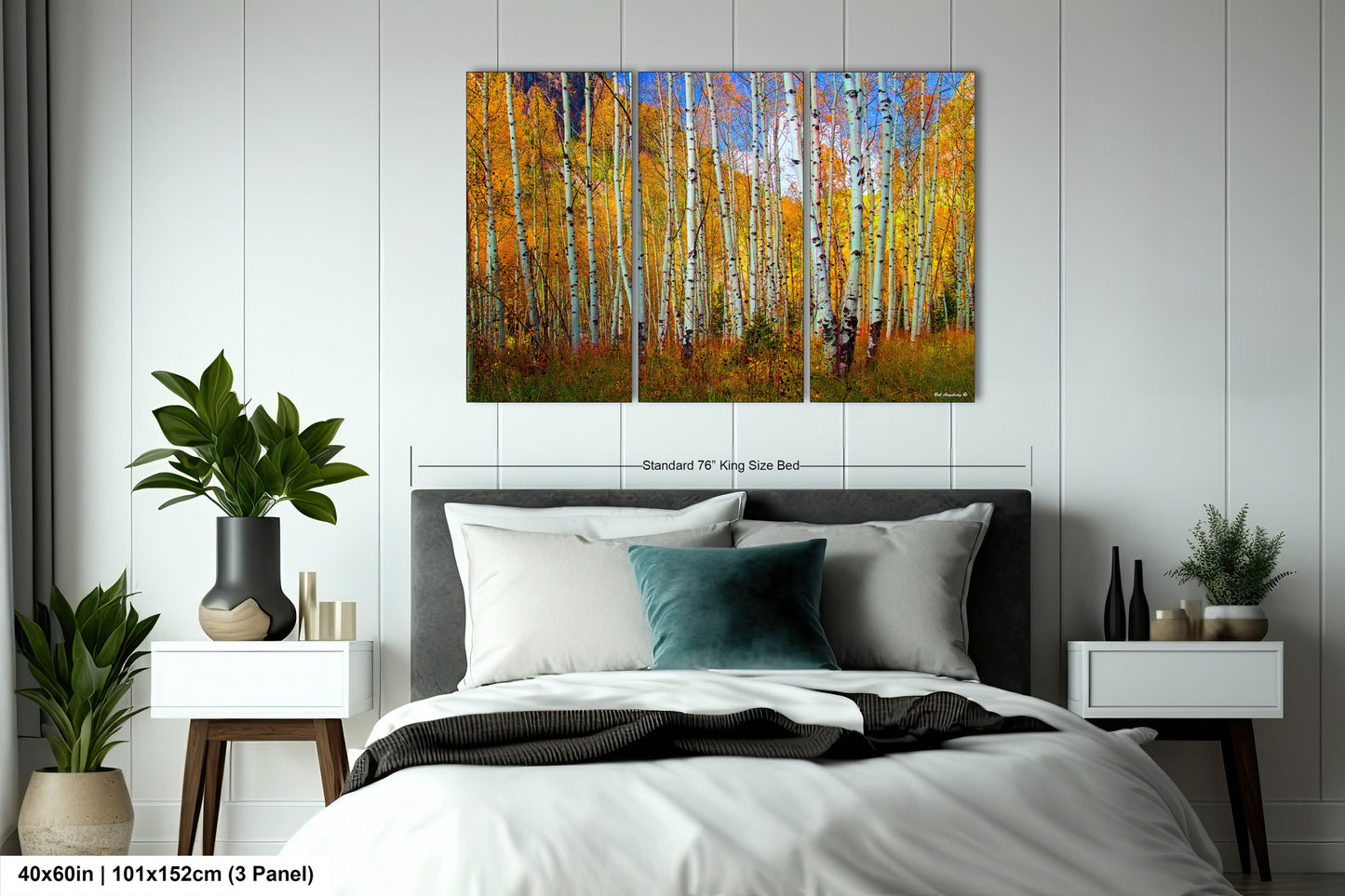 a bedroom with a bed and a painting on the wall