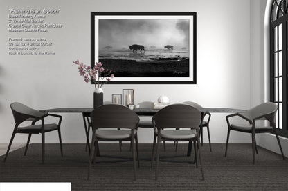 a black and white photo of a table and chairs