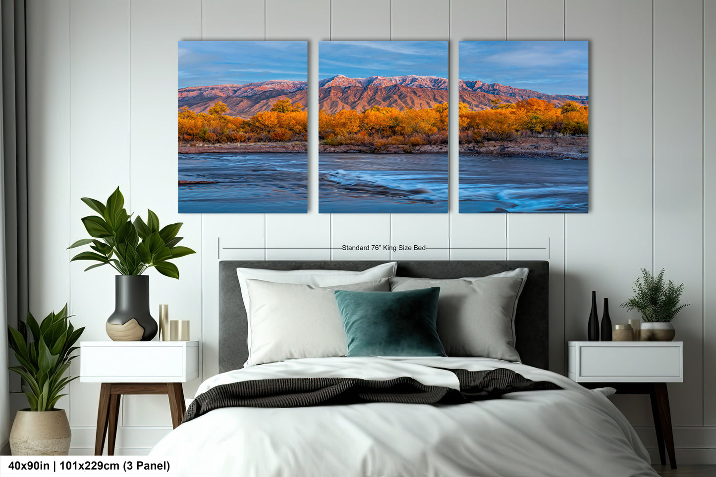 a bed room with a neatly made bed and two paintings on the wall