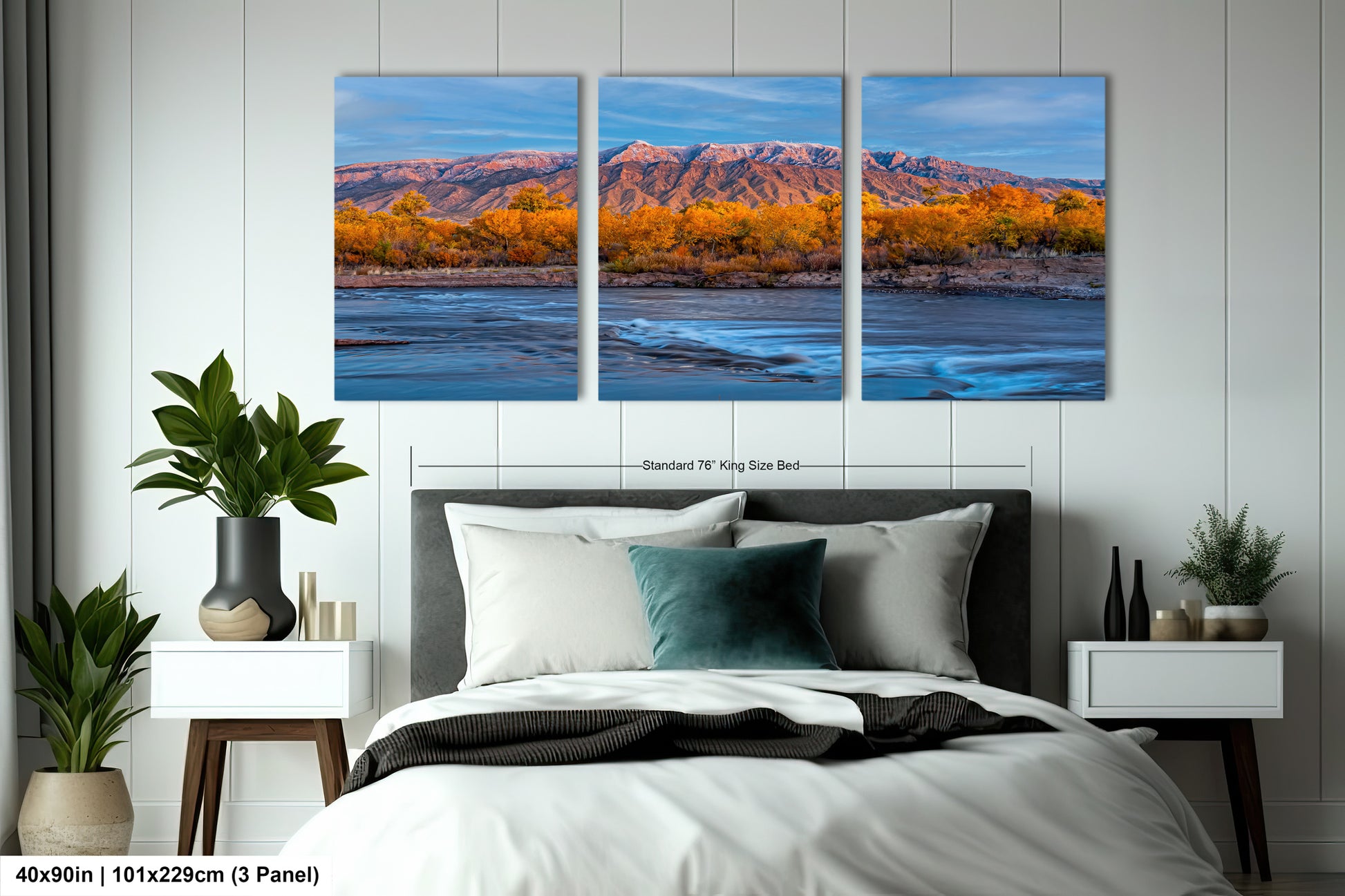 a bed room with a neatly made bed and two paintings on the wall