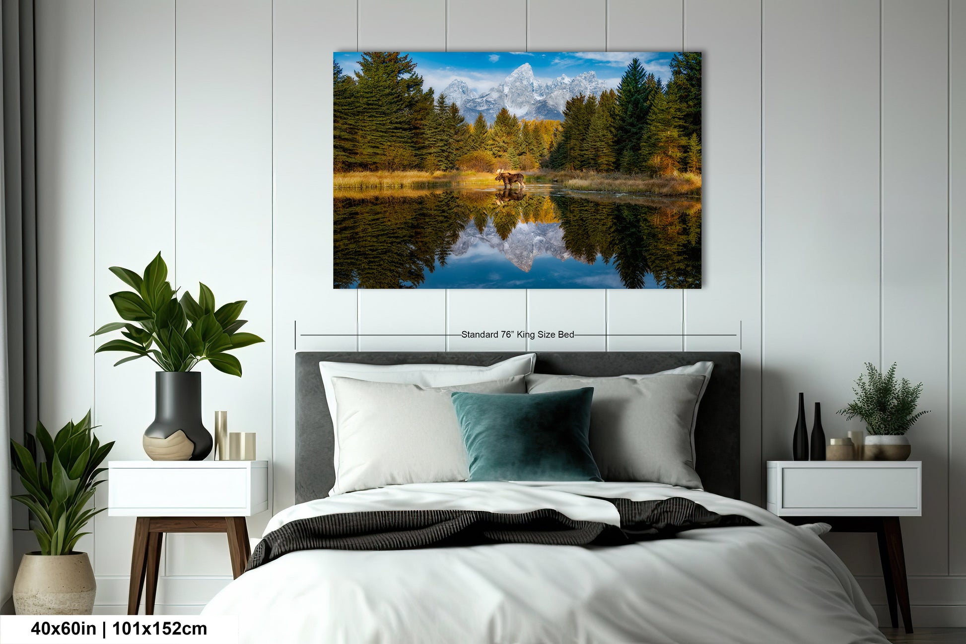 a bed room with a neatly made bed and a painting on the wall